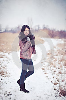 Happy girl walking in winter