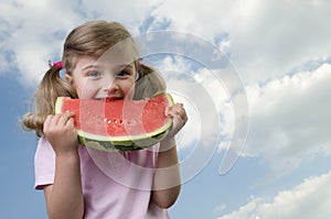 Happy girl with watermelon