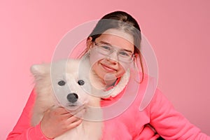 Happy girl with white dog