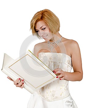 Happy girl in a white evening dress and necklace