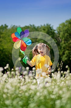 Happy girl with windmill toy