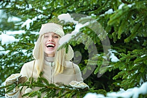 Happy girl in winter forest.