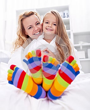 Happy girl and woman at home