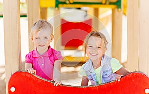 Happy girls on children playground