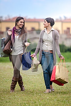 Happy girls doing shopping