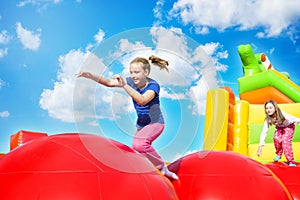 Happy Girls on Inflate Castle Cloudscape