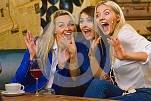 Happy girls in pub club having fun