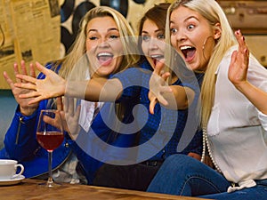 Happy girls in pub club having fun