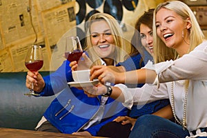 Happy girls in pub club having fun