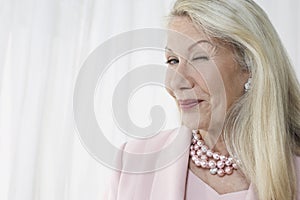 Happy And Glamorous Senior Woman Winking