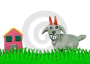 Happy Goat on grass field made from plasticine
