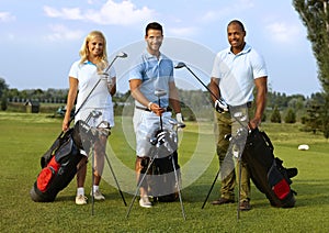 Happy golfers with golfing kit