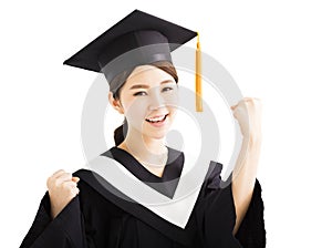 Happy graduating asian student raise hand with success gesture