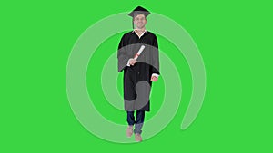 Happy graduation student walking to the graduation ceremony on a Green Screen, Chroma Key.