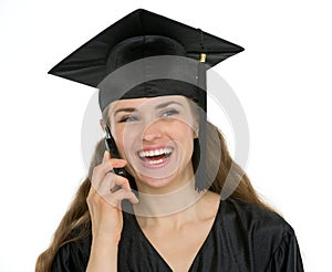 Happy graduation student woman speaking phone