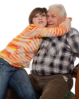 Happy grandchild hugs a happy grandad