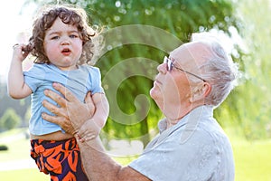 Happy granddad with grandson photo