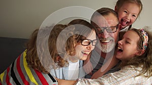 Happy grandfather and grandmother and their three grandchildren. Two generations, family traditions, grandparents and