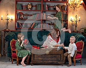 Happy grandma and grandchildren reading book at home