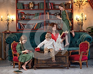 Happy grandma and grandchildren reading book together at home