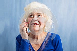 Happy grandma talking on smartphone