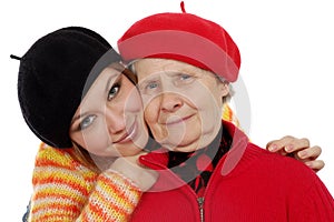 Happy grandmother and granddaughter with berets