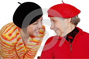 Happy grandmother and granddaughter with berets