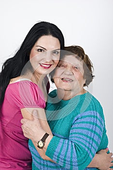 Happy grandmother and granddaughter embrace