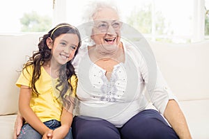 Happy grandmother and granddaughter smiling