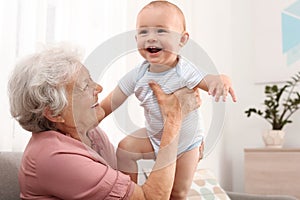 Happy grandmother with little baby