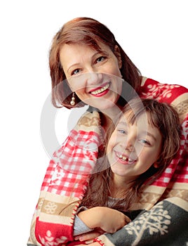 Happy grandmother and little granddaughter in Christmas blanket