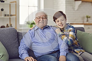 Happy grandparent and grandchildren at home concept