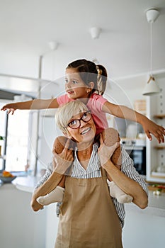 Happy grandparent playing, having fun with grandchildren