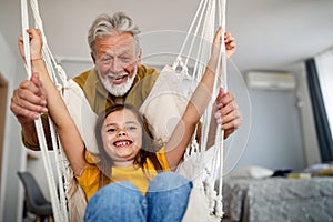 Happy grandparent playing, having fun with grandchildren