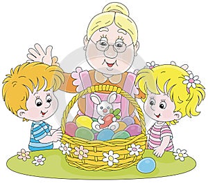 Happy granny and kids with an Easter basket
