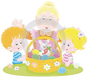 Happy granny and kids with an Easter basket