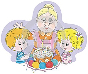 Happy granny and little kids with an Easter cake