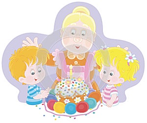 Happy granny and little kids with an Easter cake