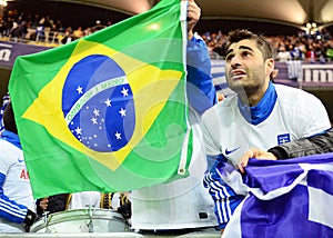 Happy greek supporters celebrate qualifying to FIFA World Cup 2014 Brazil