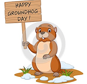 Happy groundhog day. Funny groundhog holding wooden sign