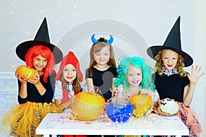 Happy group of children in costumes during Halloween party