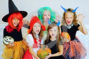 Happy group of children in costumes during Halloween party