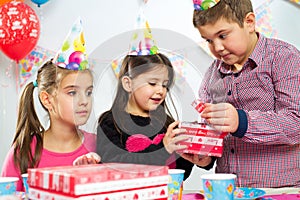 Happy group of children having fun at birthday party