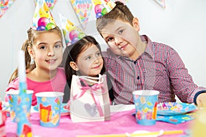 Happy group of children having fun at birthday party