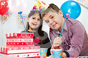 Happy group of children having fun at birthday party