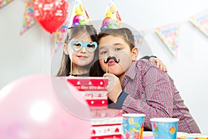 Happy group of children having fun at birthday party