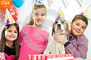 Happy group of children having fun at birthday party