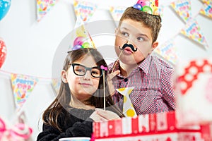 Happy group of children having fun at birthday party