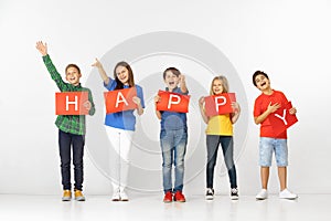 Happy. Group of children with red banners isolated in white