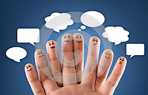 Happy group of finger smileys with social chat sign and speech b